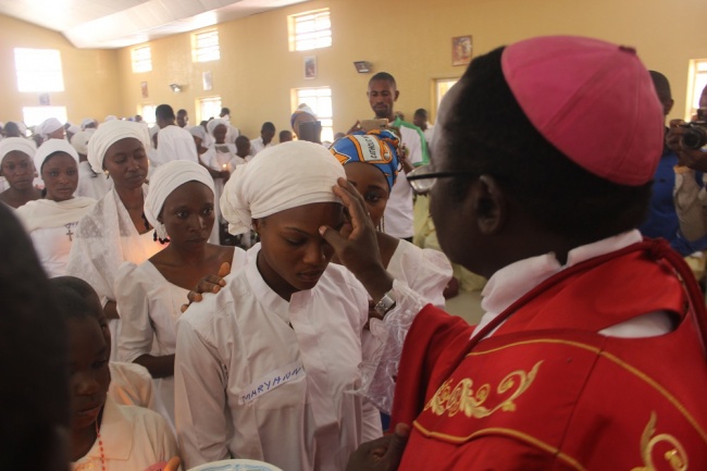 Bishop Kukah administer the sacrament of confirmation