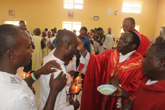 Bishop Kukah administer the sacrament of confirmation